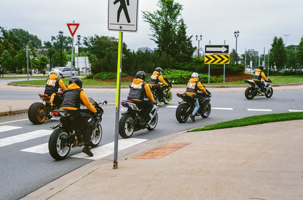 A picture of several people riding motorcycles